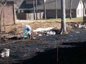 Vacuum removal of oil from affected Mayflower neighborhood