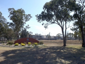 Photo of Swartz Barracks welcome sign and buildings at Army Aviation Centre Oakey in Oakey, Queensland, Australia. By Shiftchange (Own work) [CC0], via Wikimedia Commons